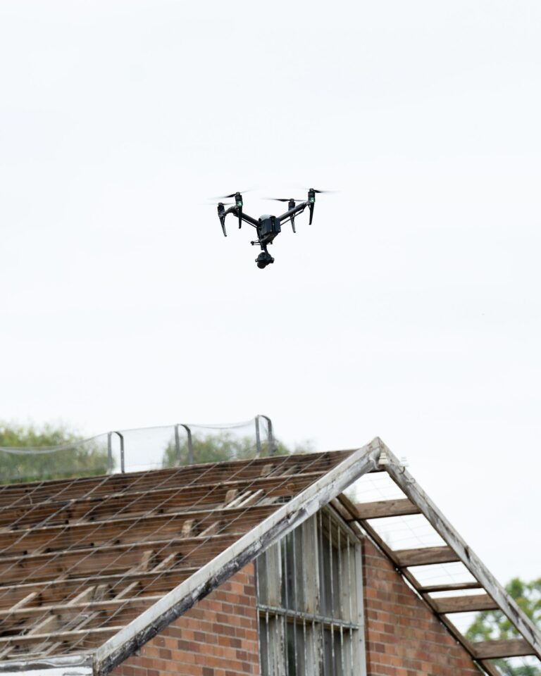 Aerial drone flying over a weathered rooftop in Sydney, capturing unique architectural views.